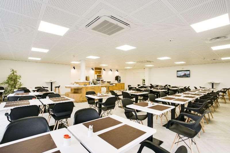Brit Hotel Confort لوش المطعم الصورة